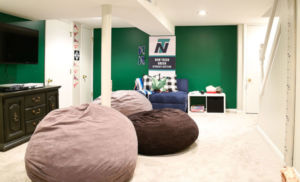 Basement, green walls, huge pillow-seats on the floor