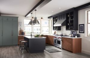 Dark grey Island and grey and brown counters in luxury kitchen