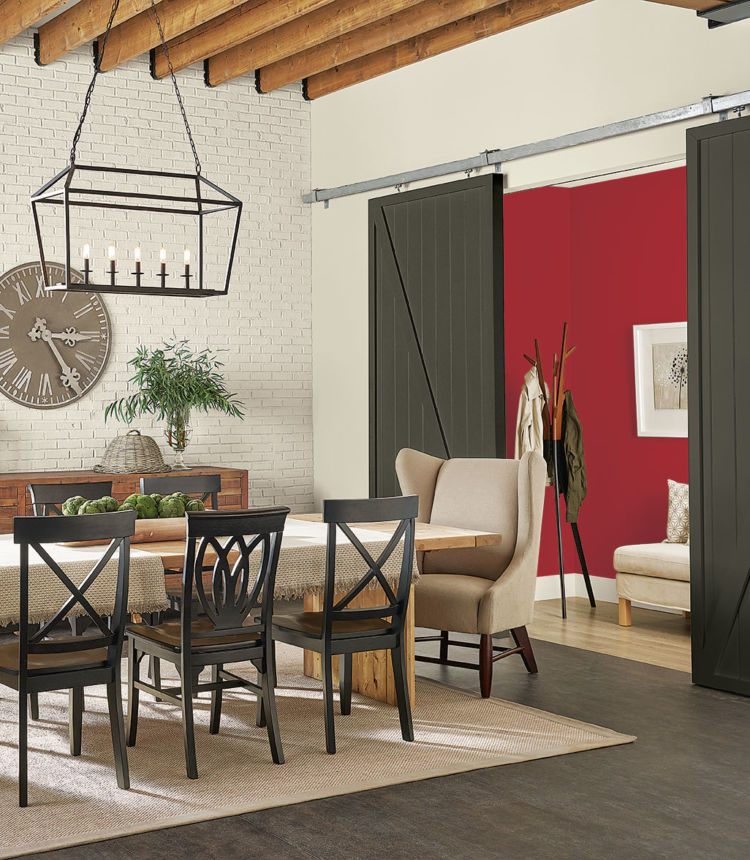 old styled dining room, white brick wall and red wall on the side behind wooded sliding doors, table and chairs