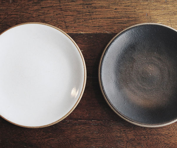 Two bowls: One white, one a deep earthy blue.