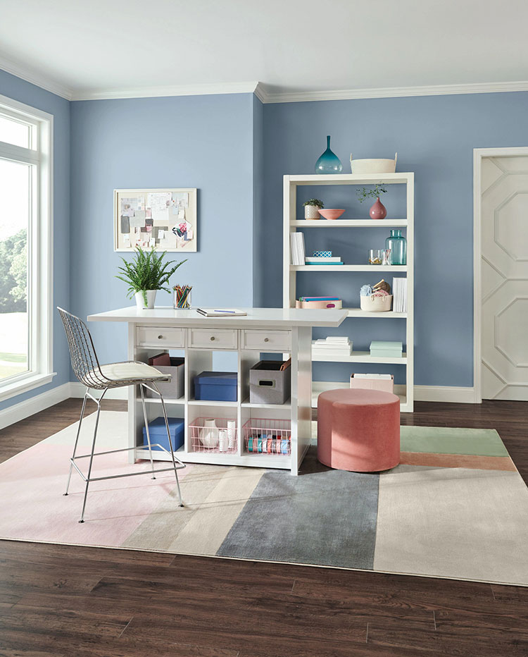 home craft room with organizational furniture.