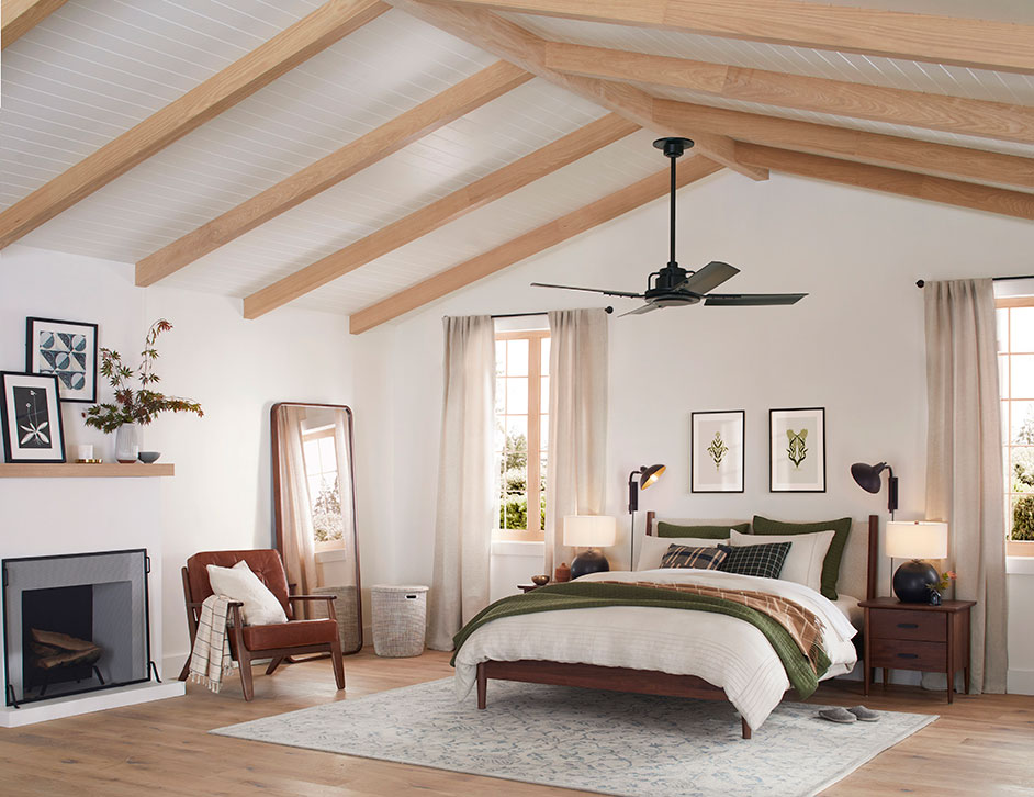 High-ceiling bedroom with exposed beams.