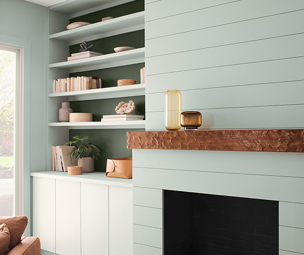 Close up of shelving painted Copen Blue SW 0068 with minimalist decorations