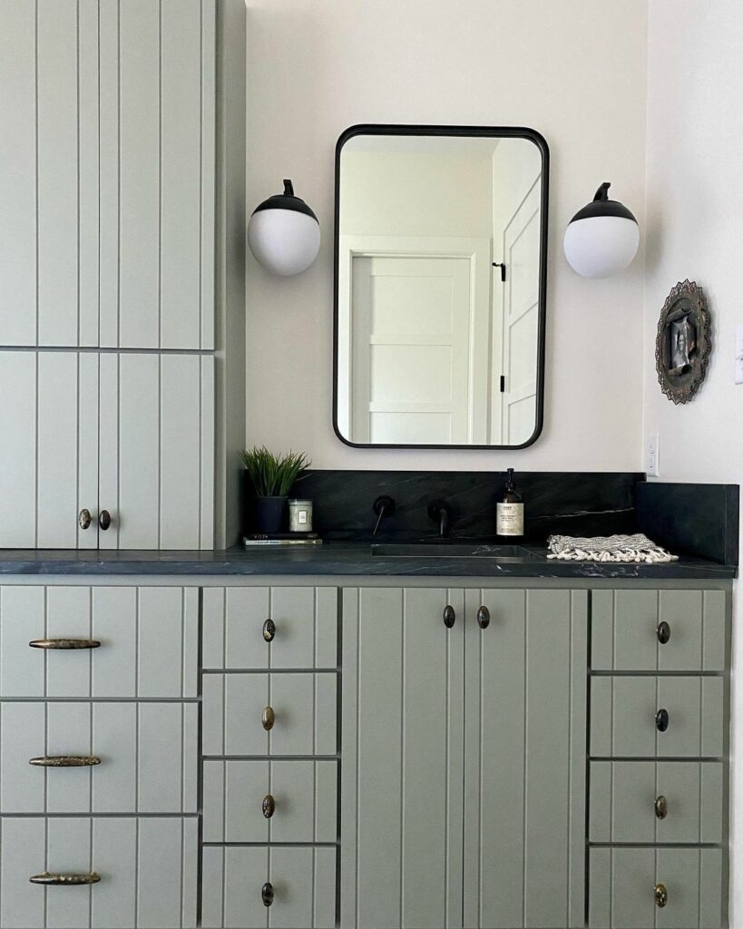 Upper and lower bathroom cabinets painted in Evergreen Fog from Sherwin-Williams.
