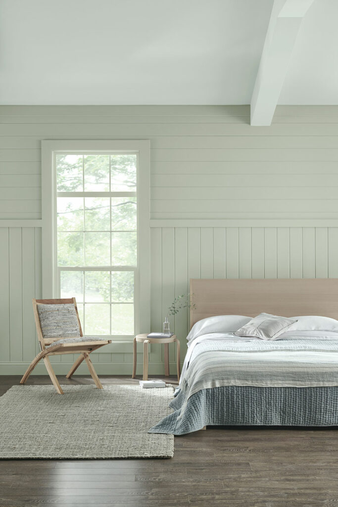 bedroom vignette featuring walls painted in Escape Gray SW 6185.