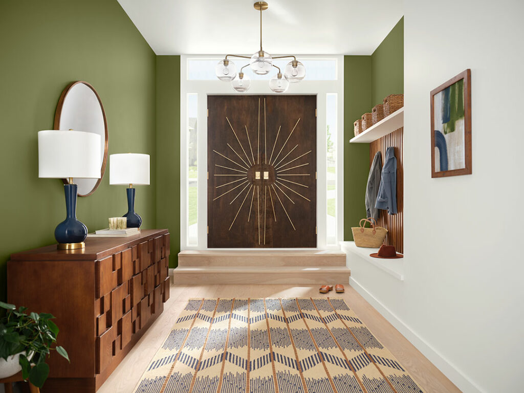 Large entryway painted with green and white walls.