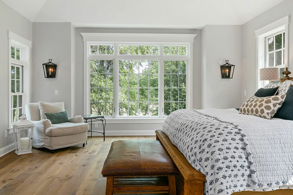 image of a bedroom with wide windows.