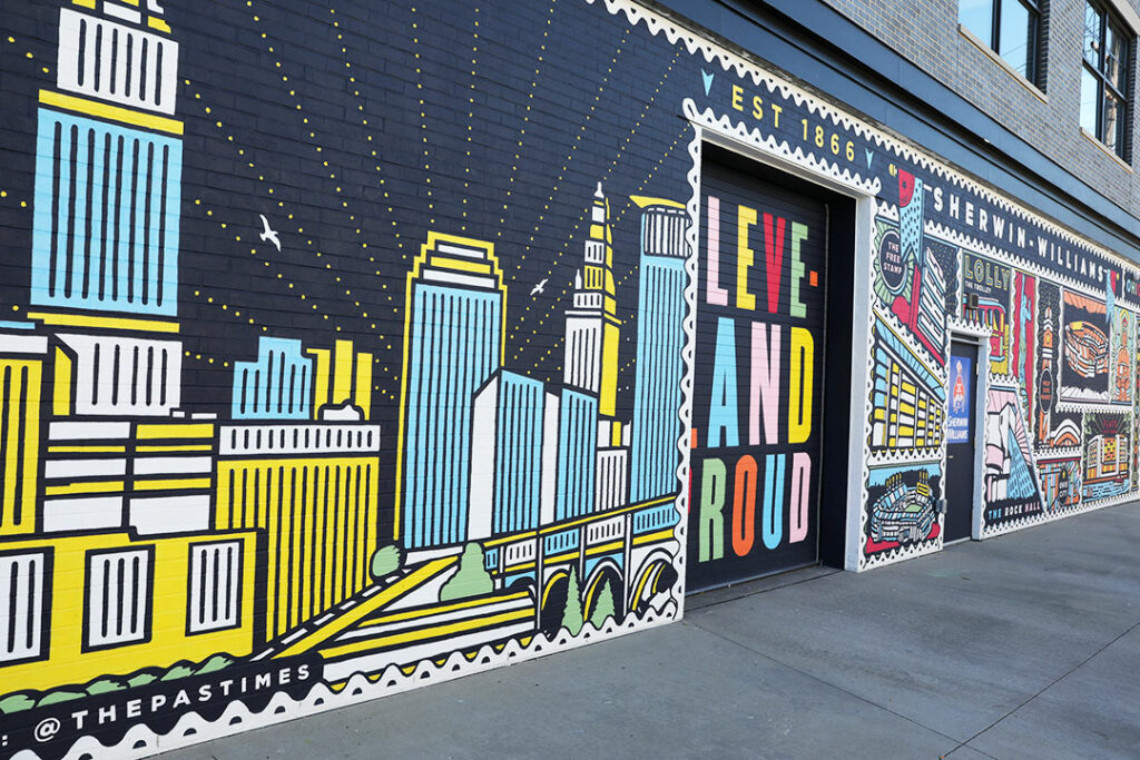 A postcard inspired mural featuring art of the city of Cleveland.