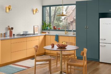 Mid-century style kitchen with cabinets painted in Bakelite Gold and Still Water.