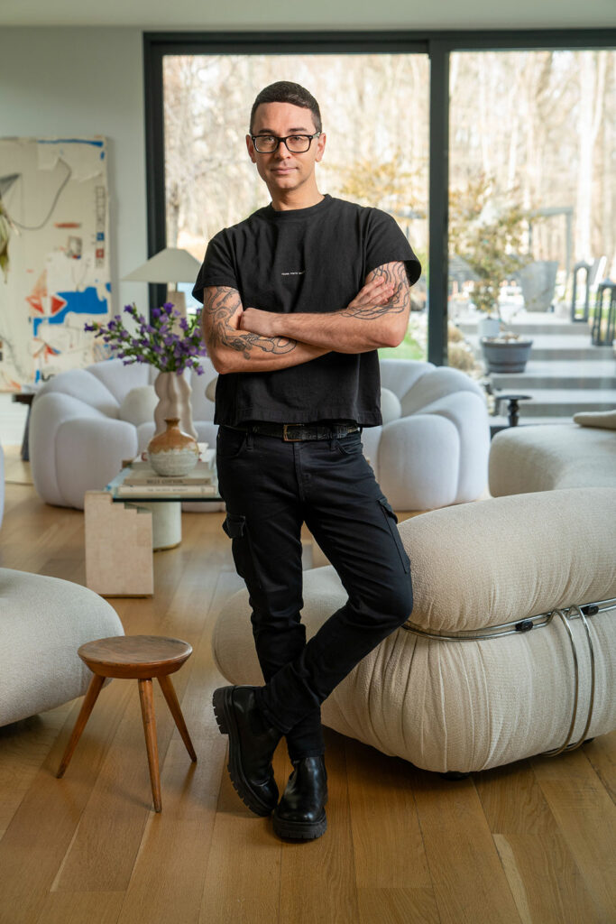 A feature image of Christian Siriano in his living room.