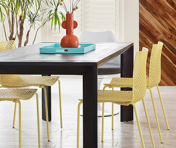 Dining room area with chartreuse-colored dining chairs.