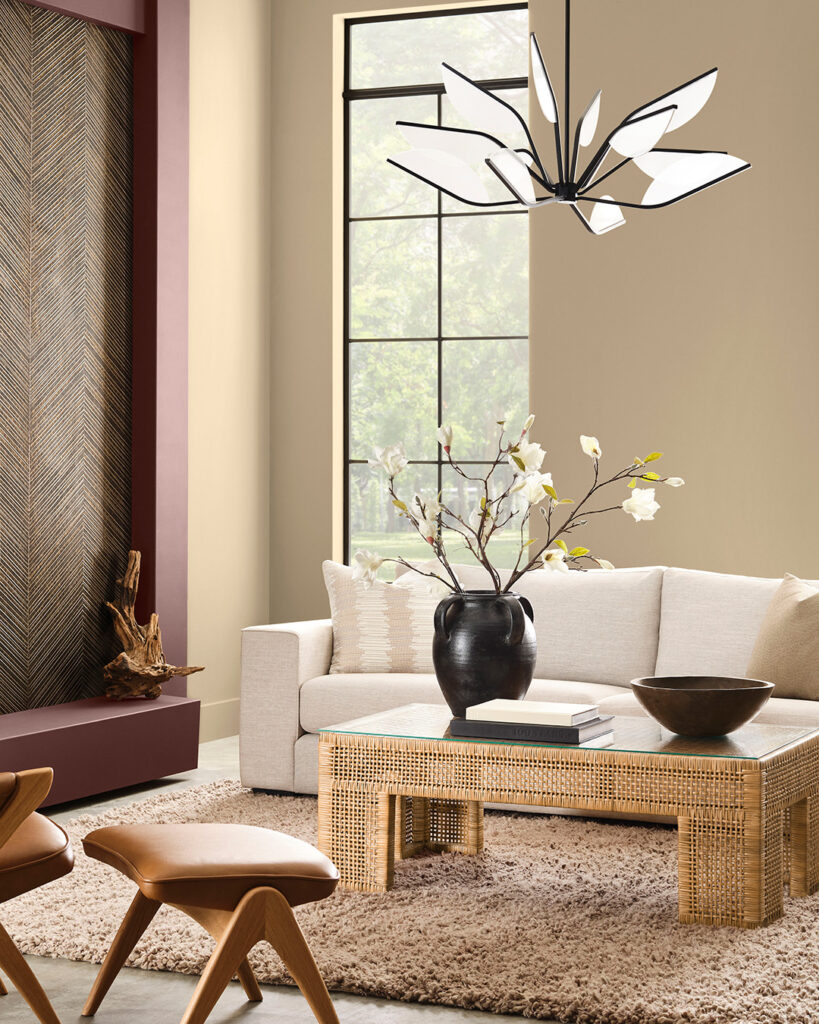 Living room space with walls painted in Universal Khaki and a fireplace surround painted in Dark Auburn.