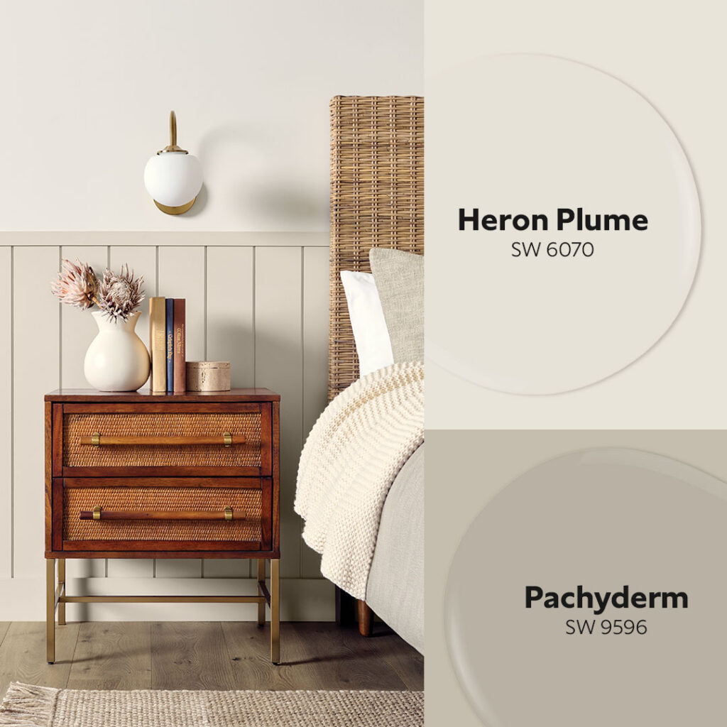A bedroom image with wainscoting painted in Sherwin-Williams Pachyderm and wall painted in Heron Plume.
